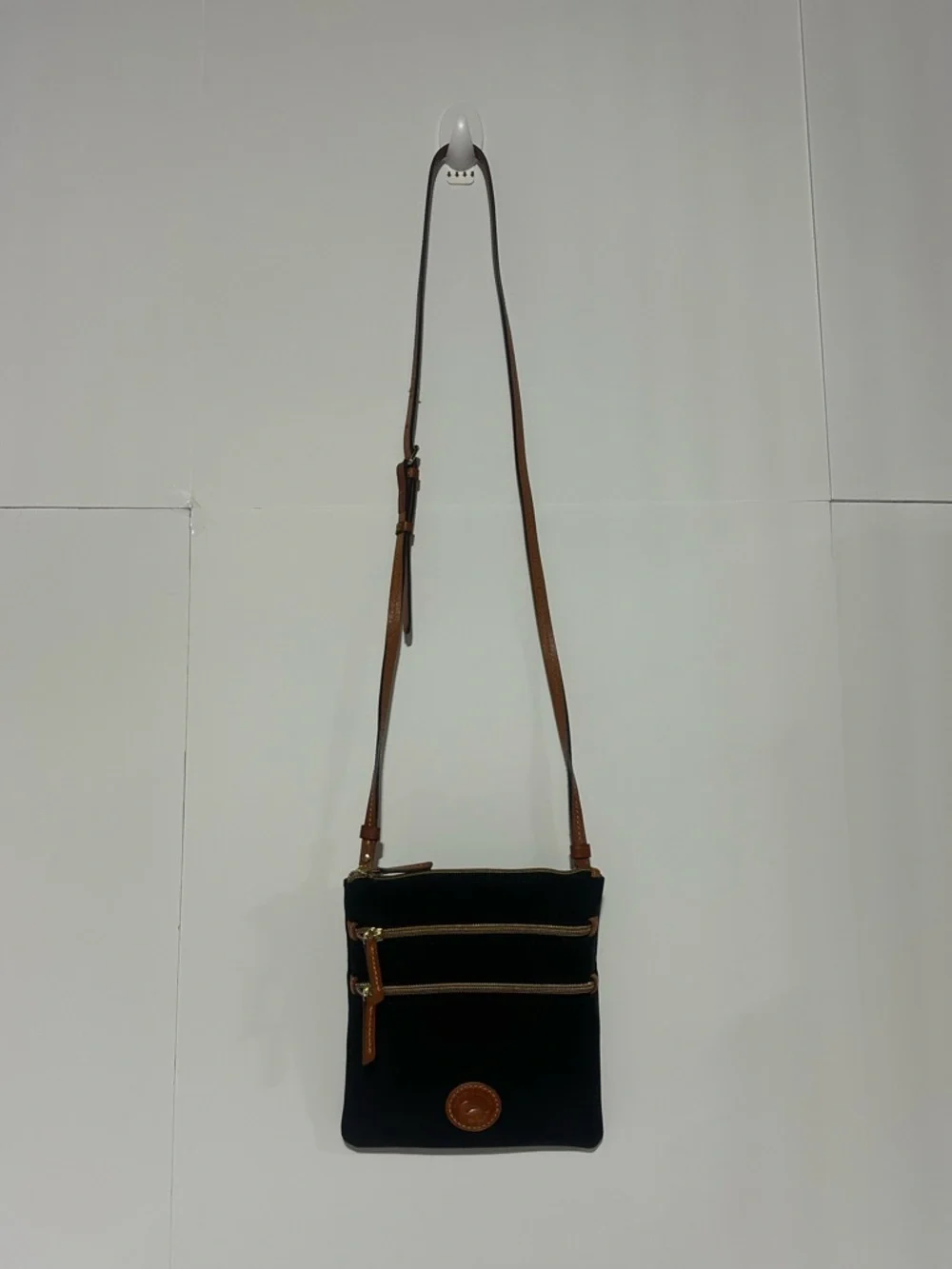 Dooney & Bourke North South Triple Zip Black Crossbody with Brown Leather Strap
